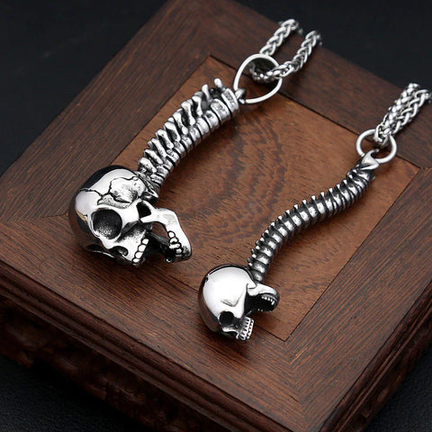 Two stainless steel skull pendants on a chain — memento mori skull jewelry for men
