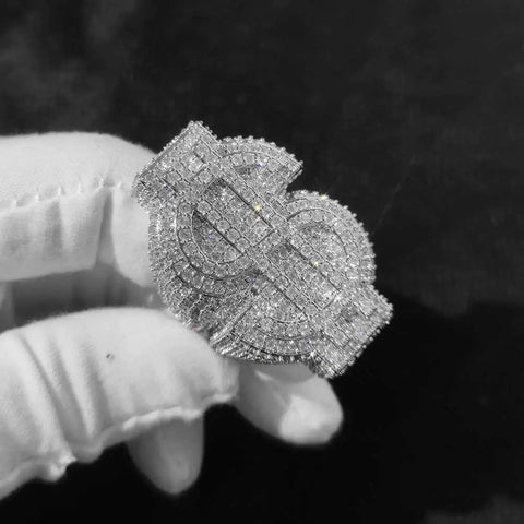 Statement rings men wear — fully iced-out money-sign statement ring on a gloved hand