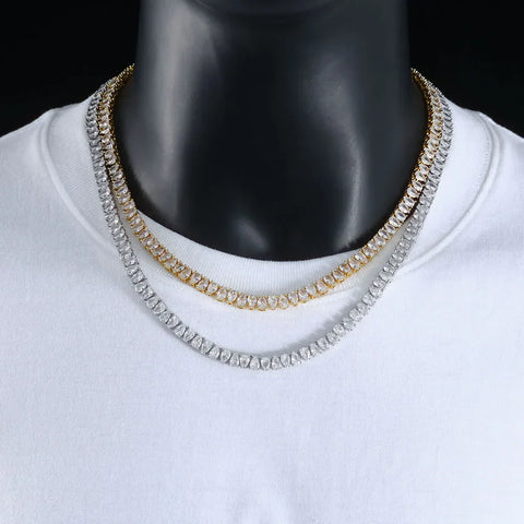 How to style a tennis chain: two tennis chains layered gold over silver on a white tee