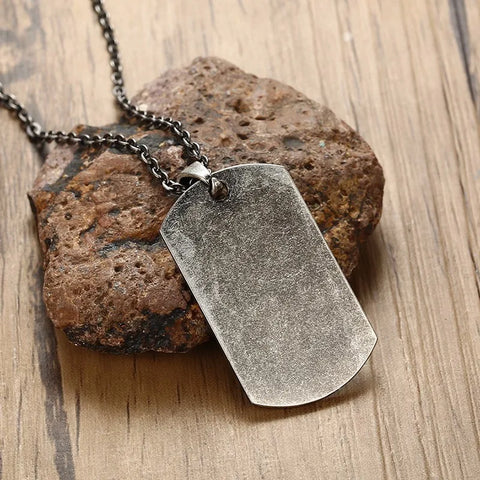 dog tag necklace for men shown by a clean rectangular pendant