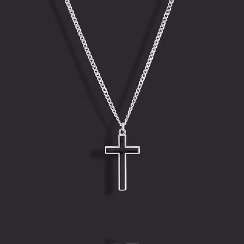 Black cross pendant outfits — minimalist black cross pendant on a silver chain