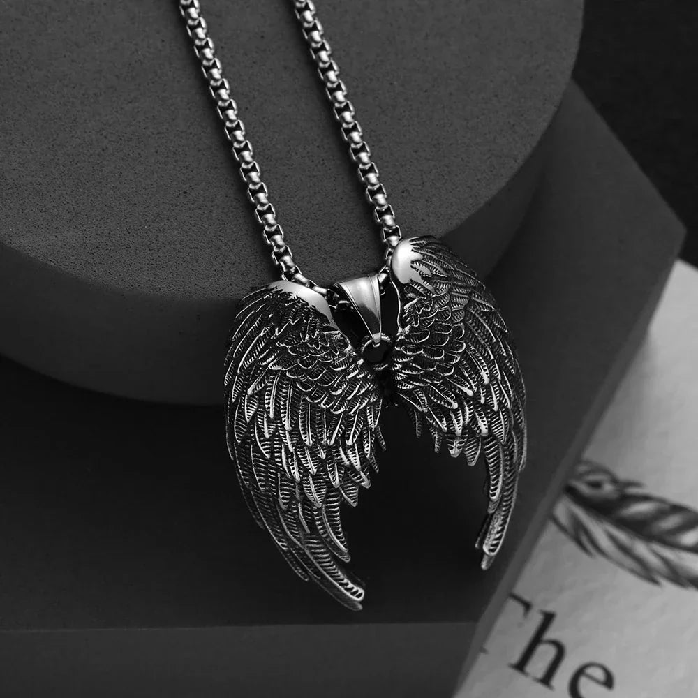 Stainless steel angel wing pendant on dark backdrop — drill aesthetic cold look pendant