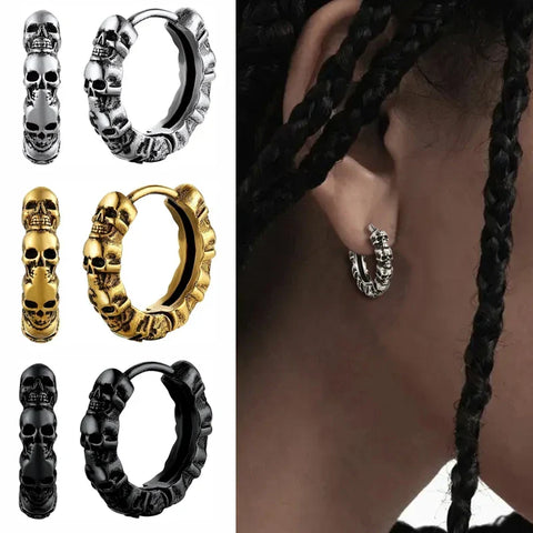 Silver skull hoop earring on man with braids — drill men's earring style statement
