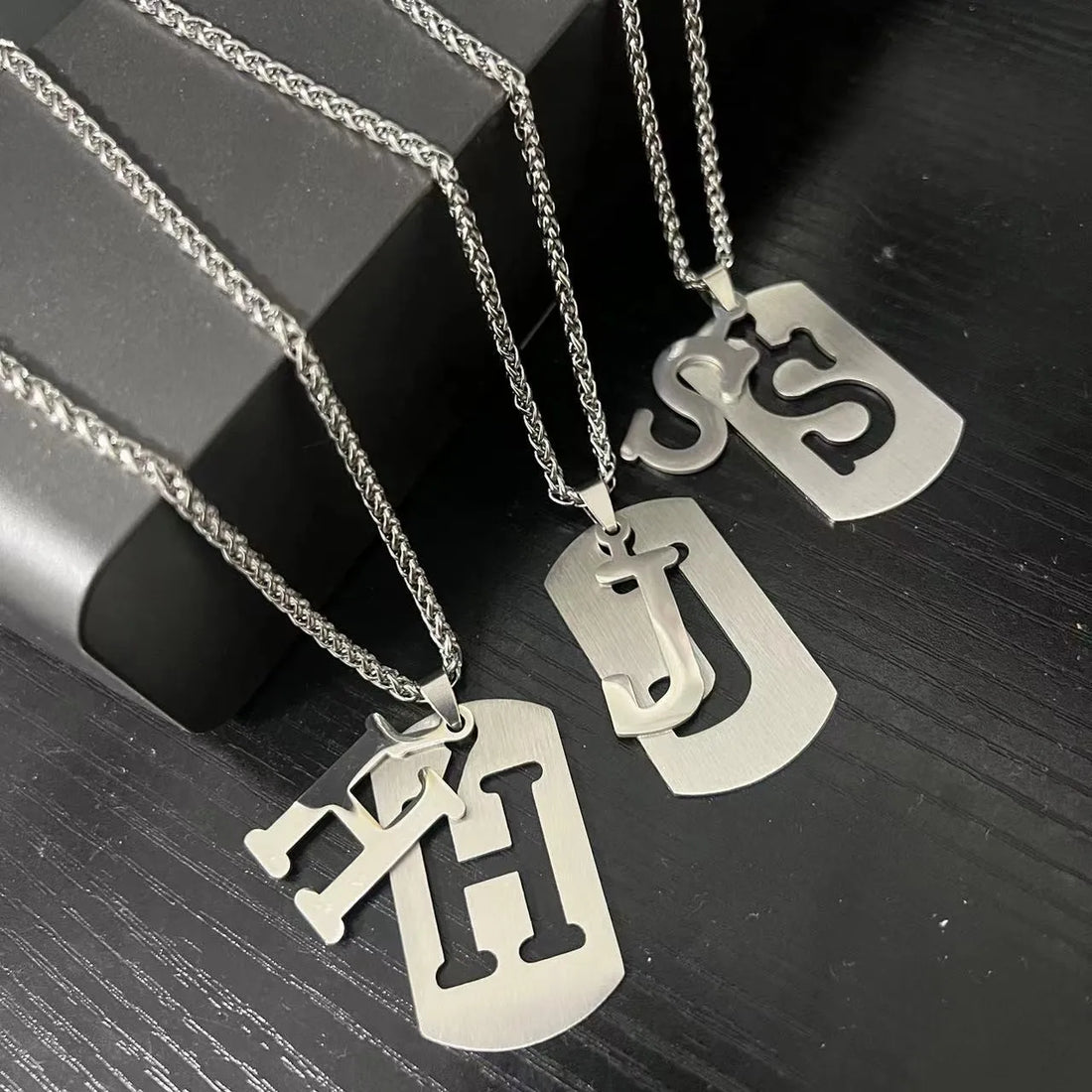 Stainless steel initial pendants for men — cut-out H, J and S letter tags on rope chains