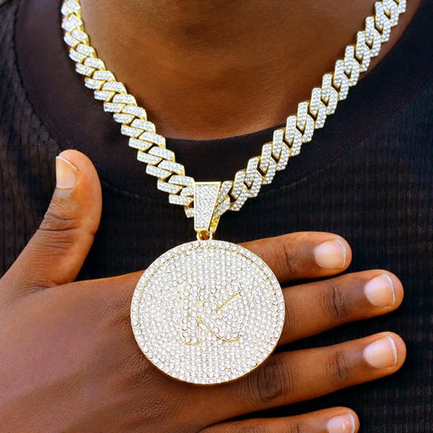 Iced out letter pendant hip-hop style worn on an iced Cuban link chain