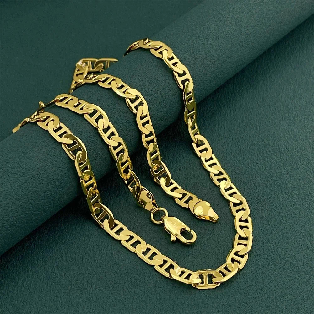 Gold Figaro chain shown full length — picking the right mens chain length gift by body type