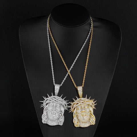 Iced-out silver Jesus piece pendant on a chain — hip-hop's most sacred flex
