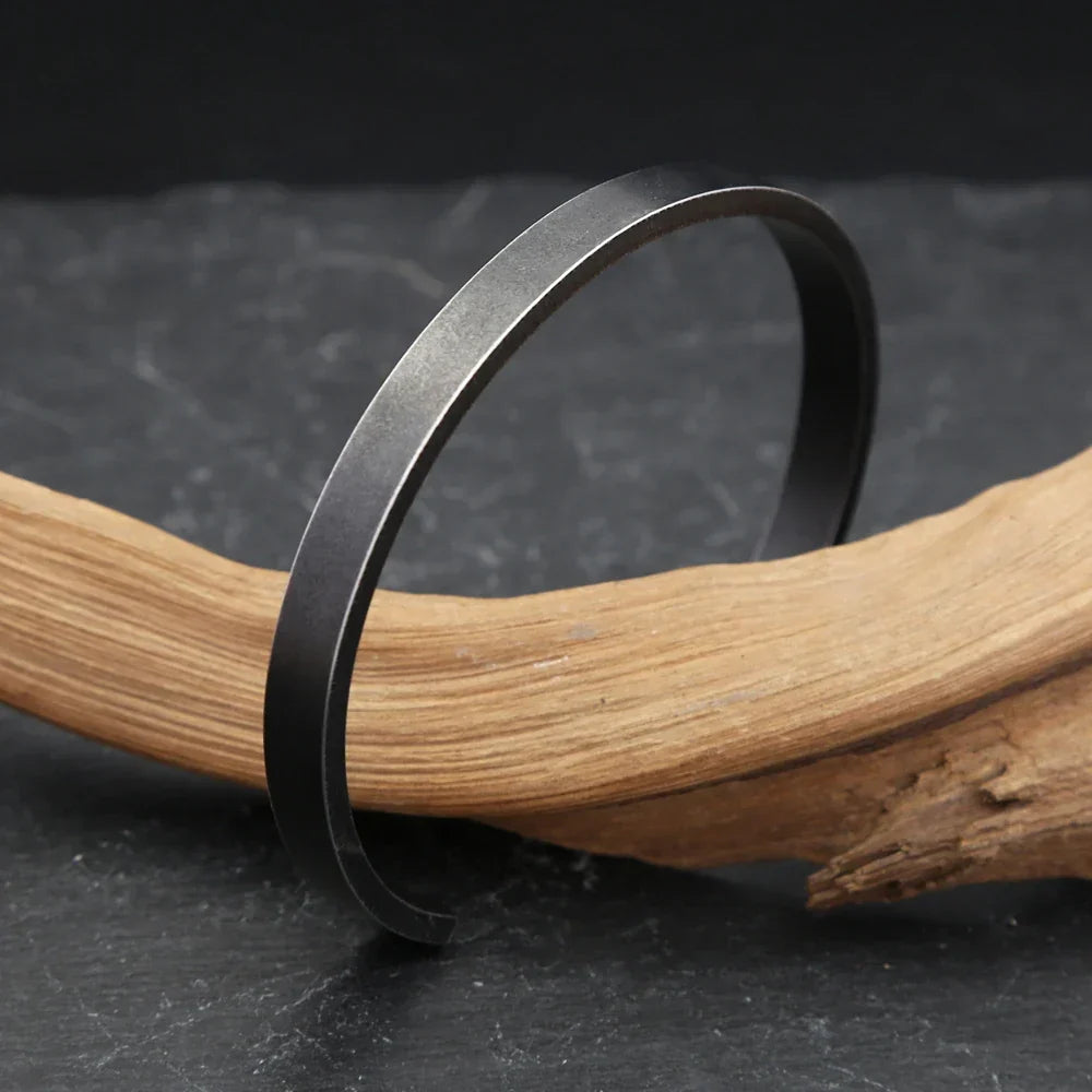 cuff vs chain bracelet example with a black cuff
