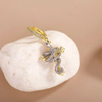 Iced Out Cross Snake Dangle Hoop Earrings