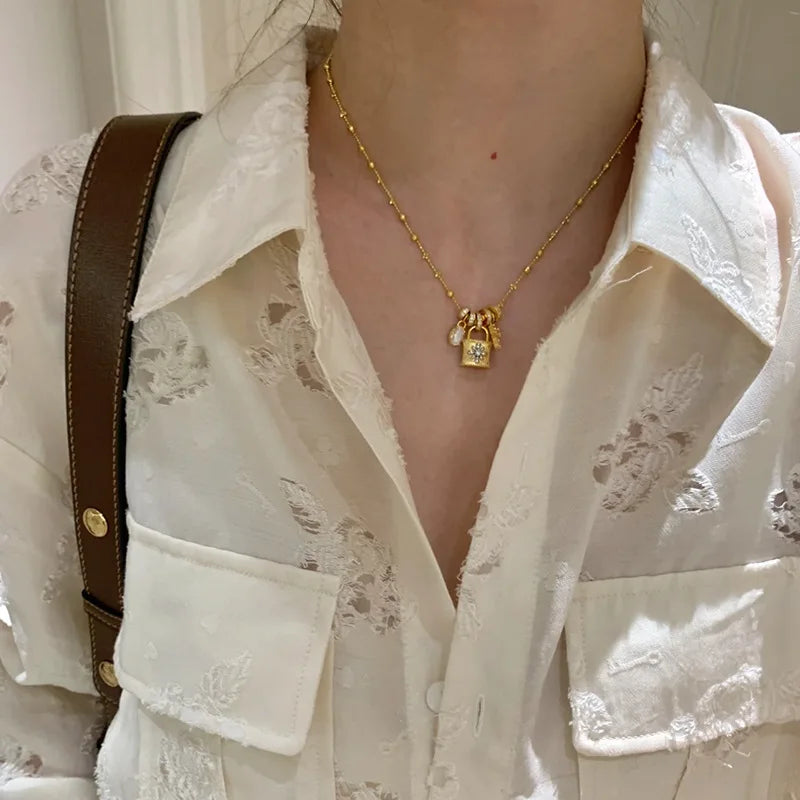 Lace Craft Running Ring Cross Pendant Lock Bag Necklace Luxury Premium Feel Collarbone Chain Niche New Sweater Chain