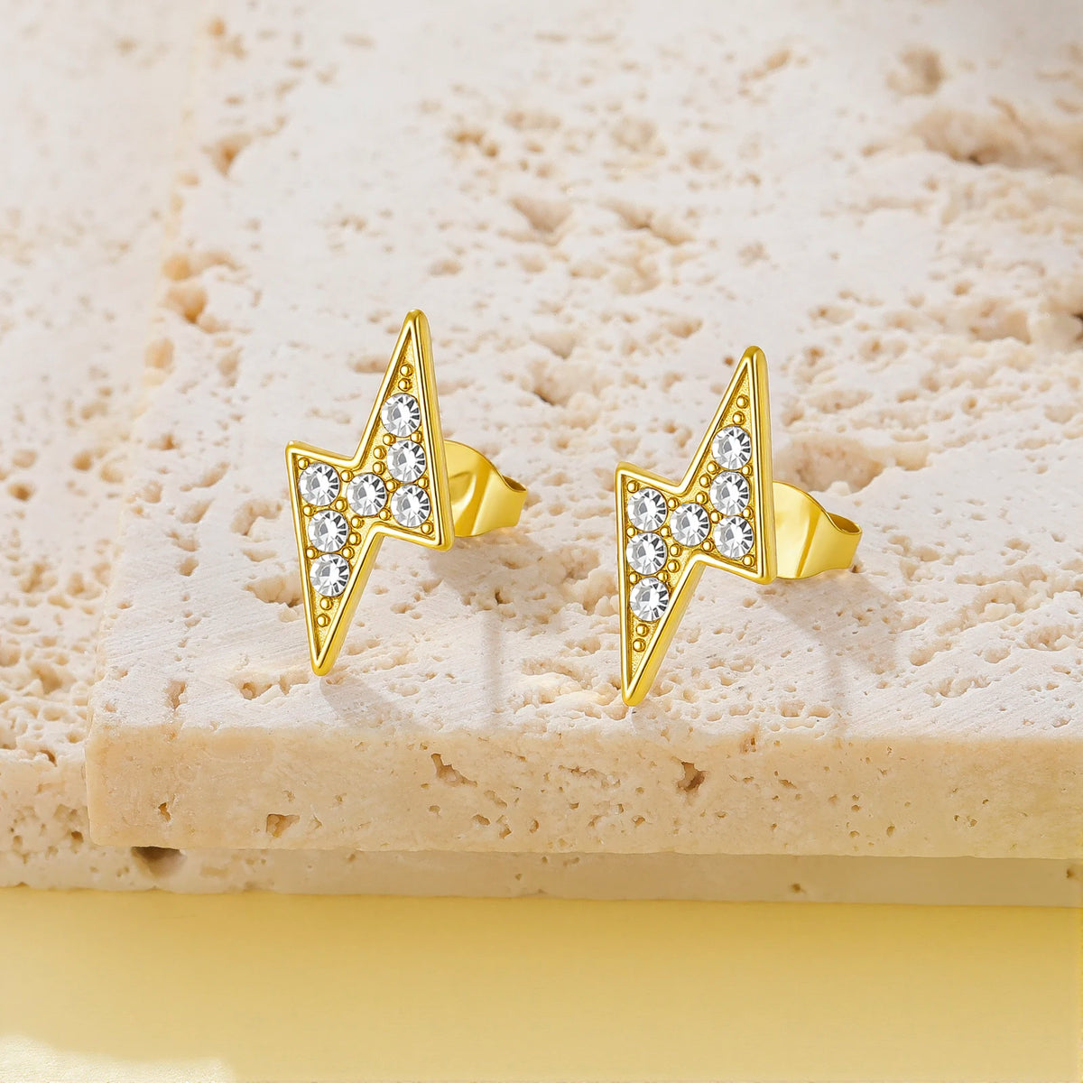 Iced Out Lightning Bolt Stud Earrings — Stainless Steel